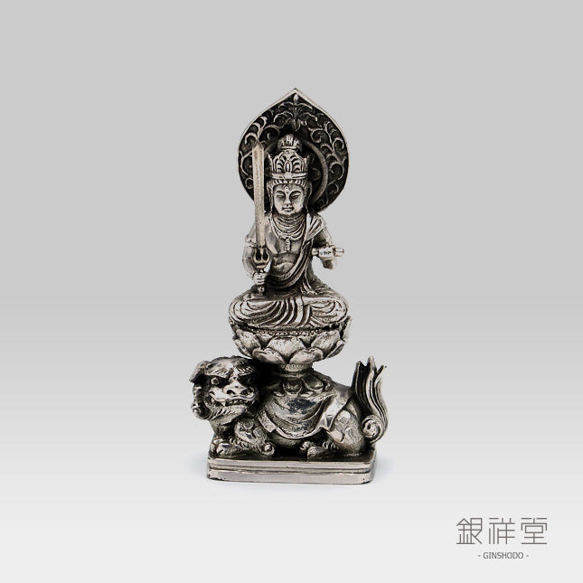 silver buddha statue